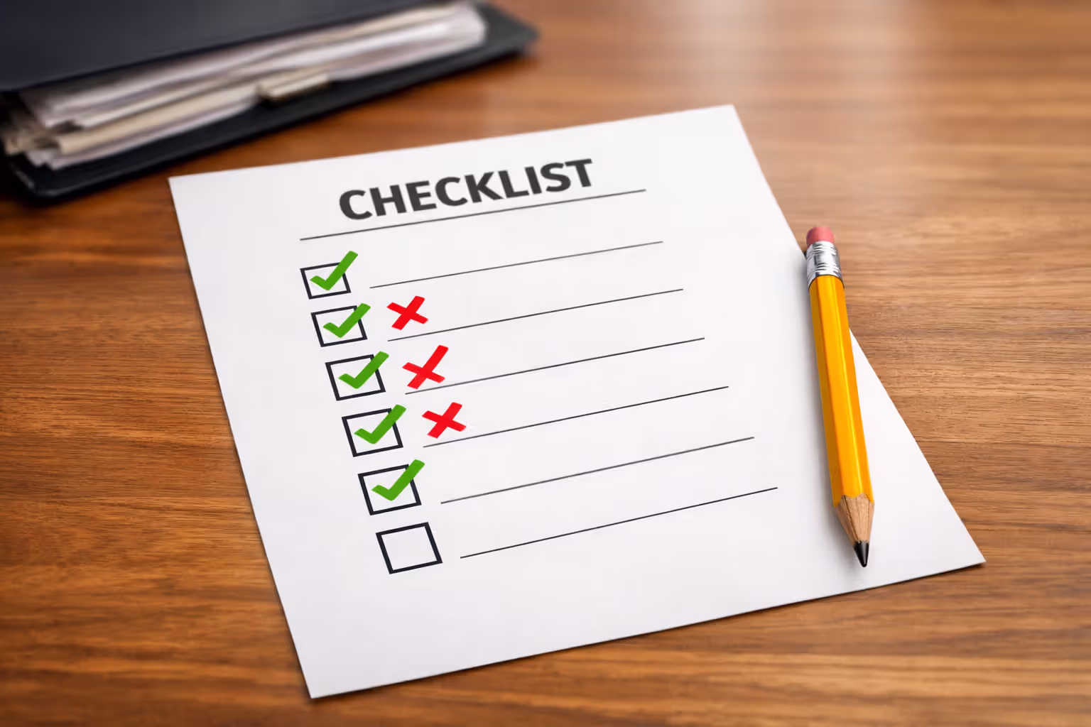 Checklist on paper with checkmarks and crosses next to items symbolizing common application mistakes